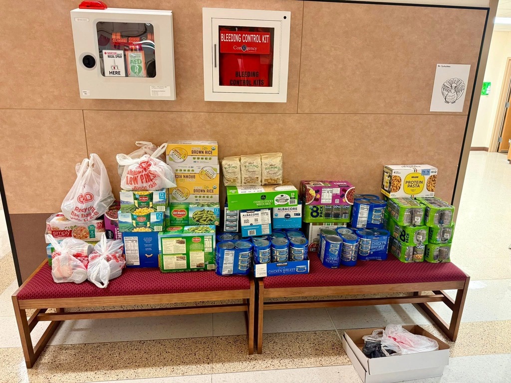 Photo of bench covered in canned goods