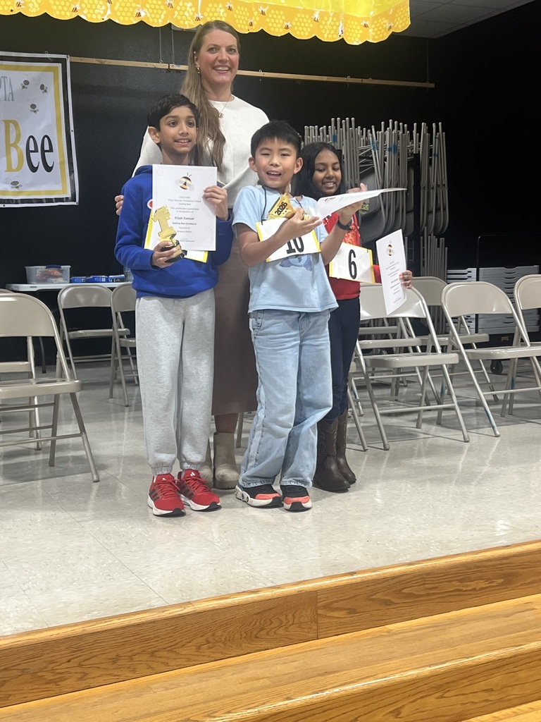 Ms. Elarms with spelling bee winners. 