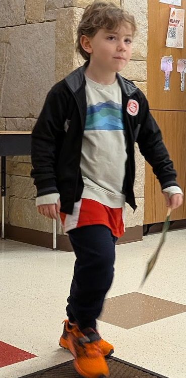 Student walking holding flag