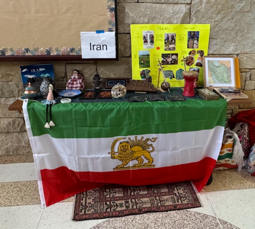 Picture of booth with Iran flag and items from Iran