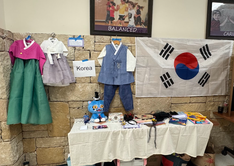 Picture of booth with clothes, flag, and items from Korea