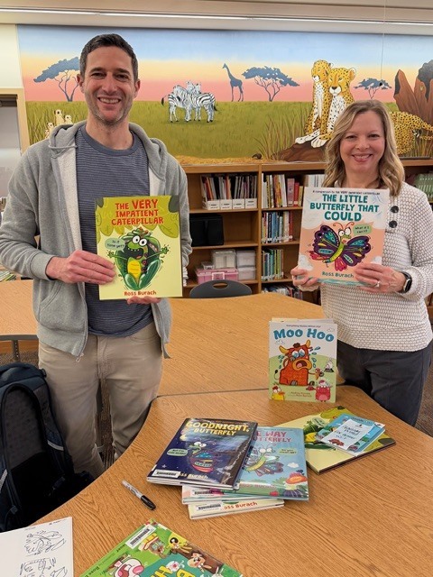 Author Ross Burach and librarian Dayna Collings standing holding books