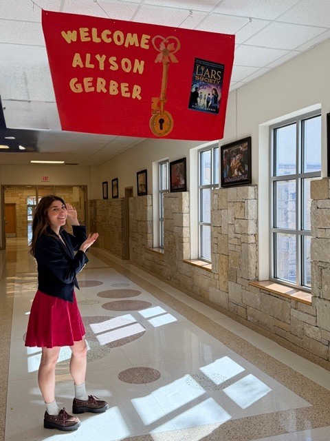Alyson Gerber standing under a red sign