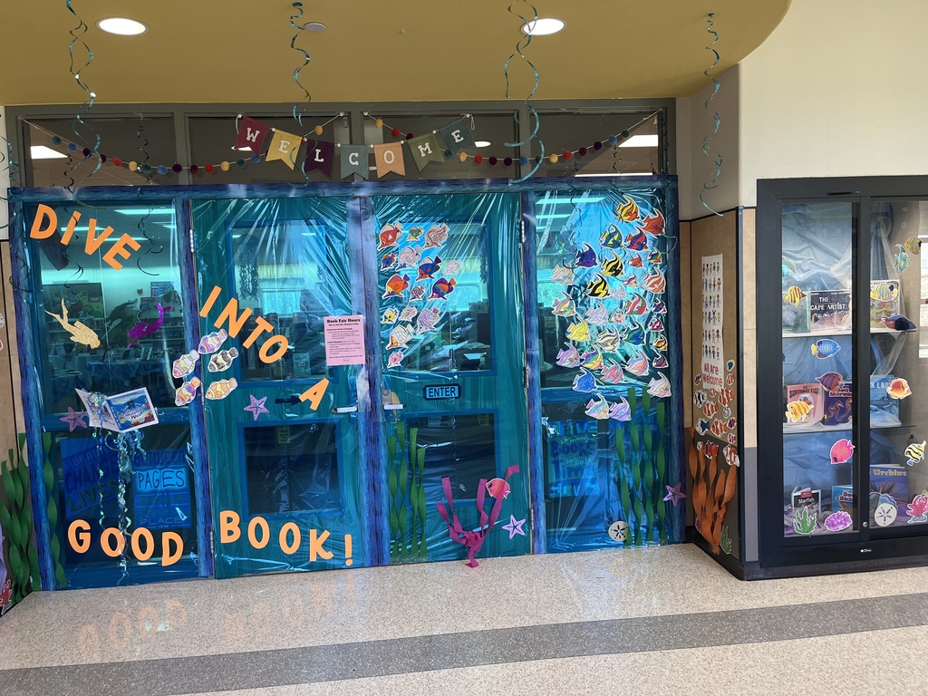 Front door to the library decorated with and ocean theme. 