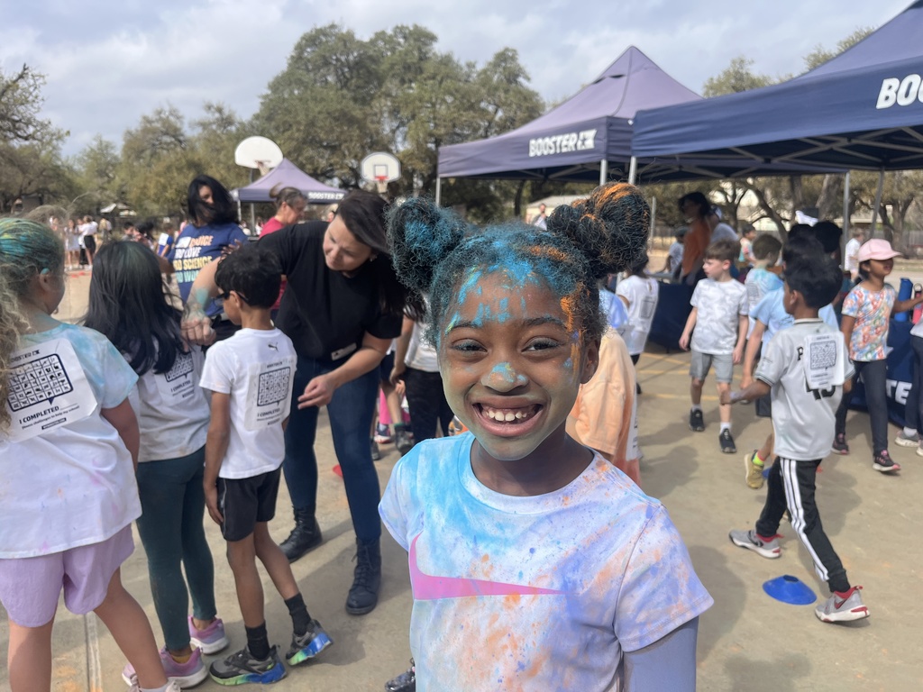2nd grader with color all over from the Color Run