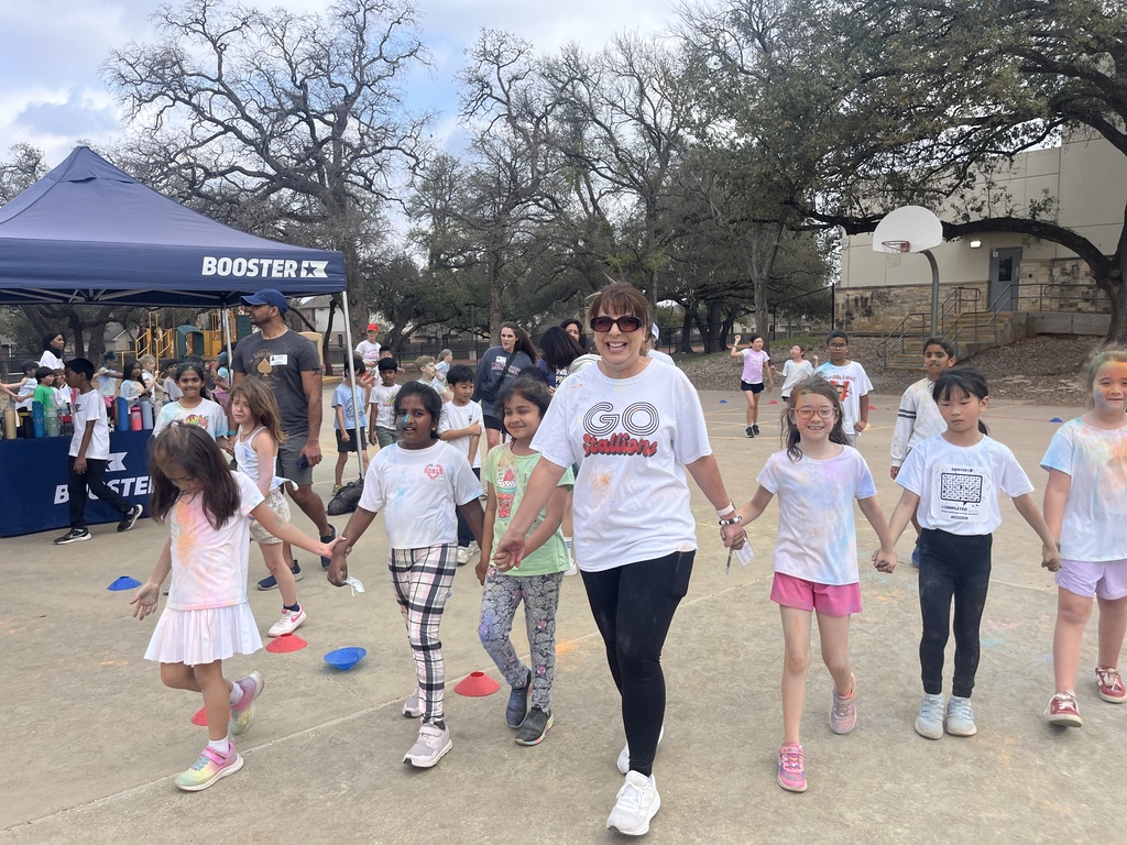 Ms. Doyal with 2nd grade friends walking during the color run