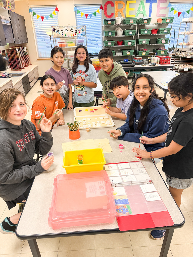 Middle school students creating artworks