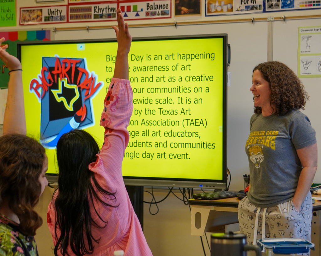 Big Art Day- Chandler Oaks Students make art on walls with blue tape.