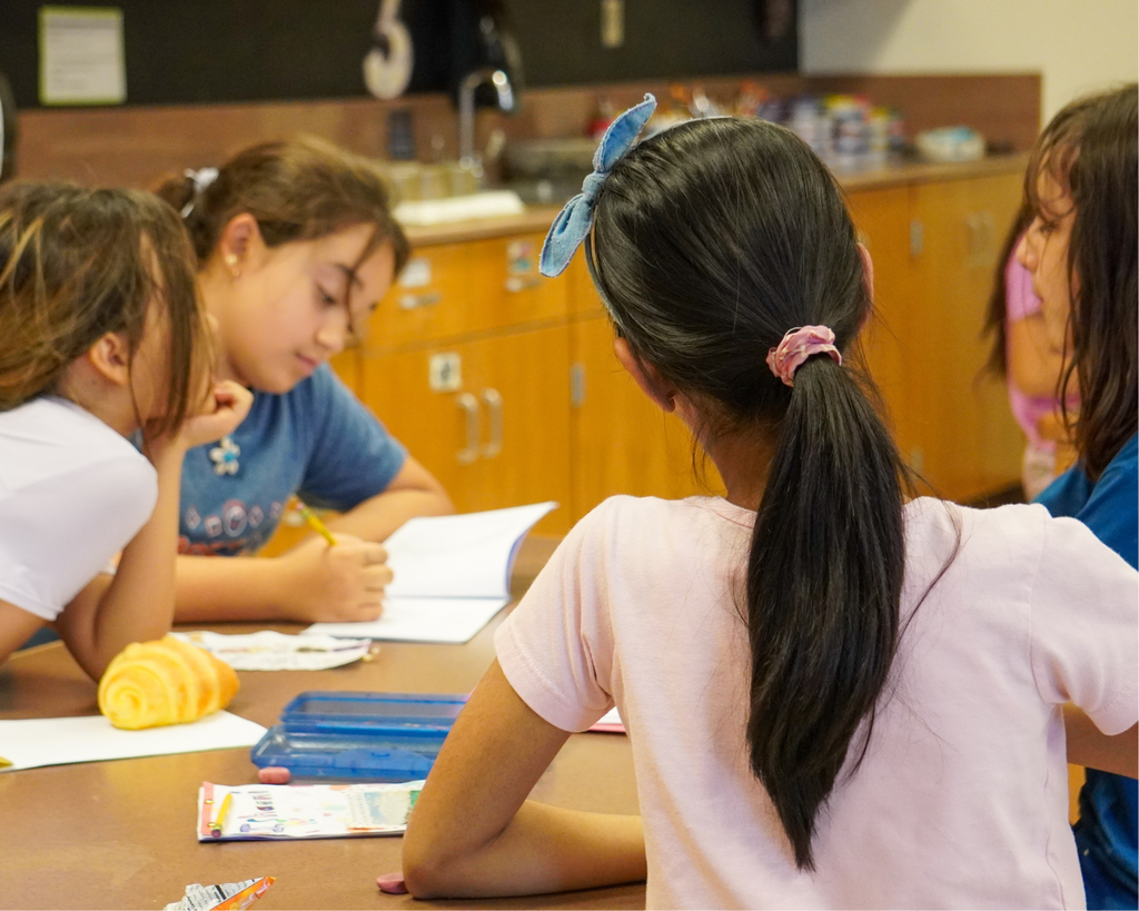 Big Art Day- Chandler Oaks Students make art on walls with blue tape.