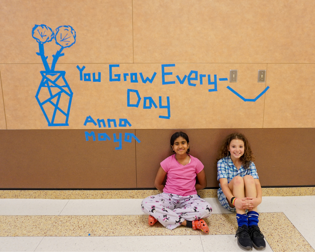 Big Art Day- Chandler Oaks Students make art on walls with blue tape.