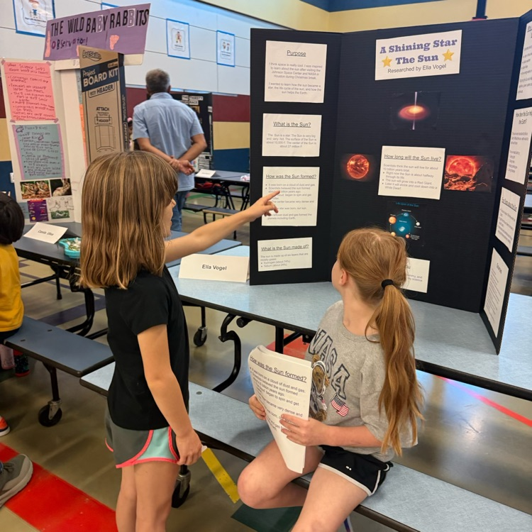 student showing science fair project