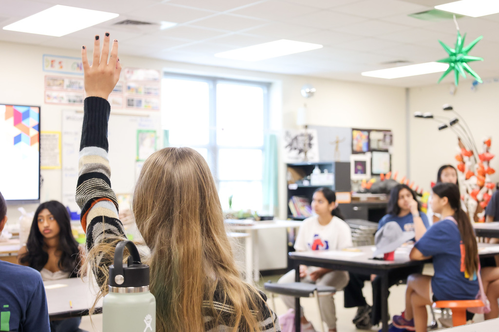 Middle school students at Visionary Voices Enrichment Event working on leadership projects and activities.