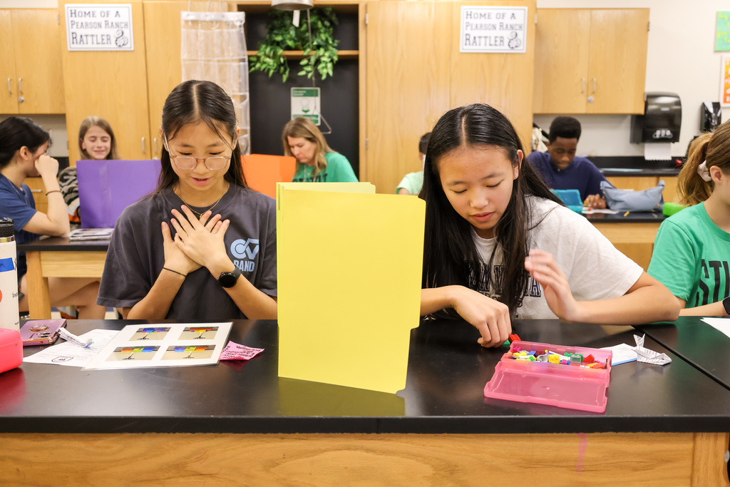 Middle school students at Visionary Voices Enrichment Event working on leadership projects and activities.