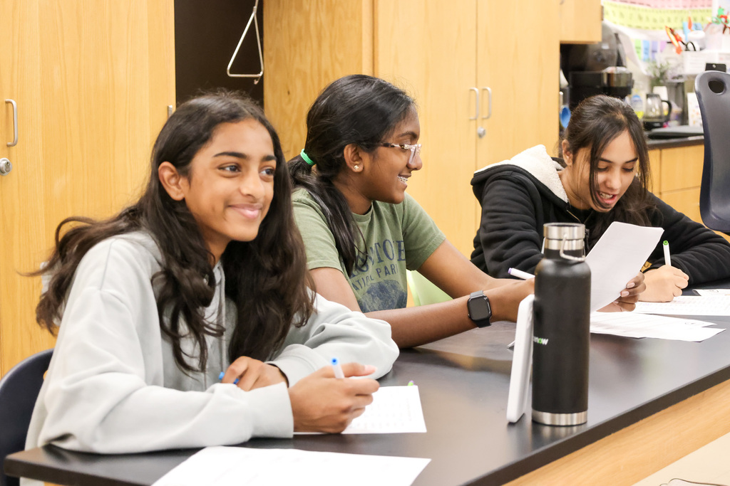 Middle school students at Visionary Voices Enrichment Event working on leadership projects and activities.