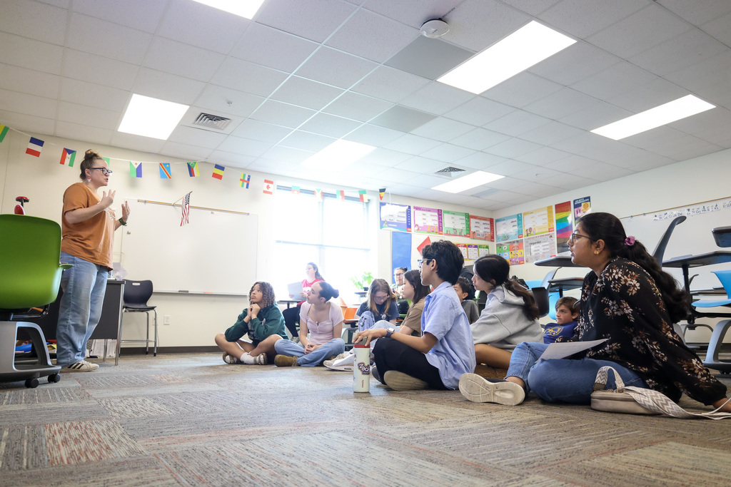 Middle school students at Visionary Voices Enrichment Event working on leadership projects and activities.