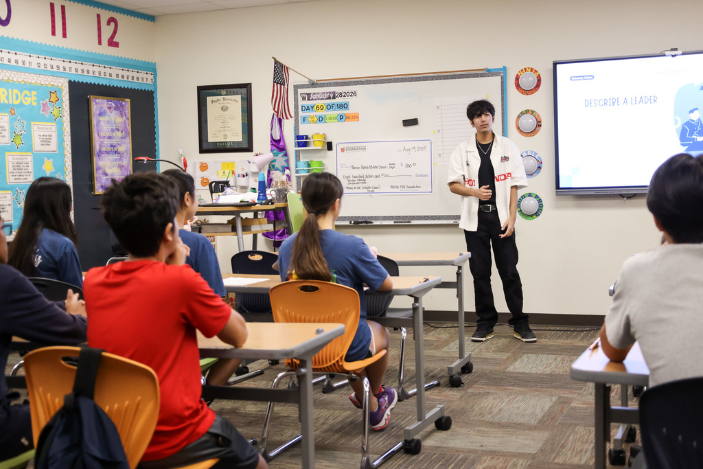 Middle school students at Visionary Voices Enrichment Event working on leadership projects and activities.