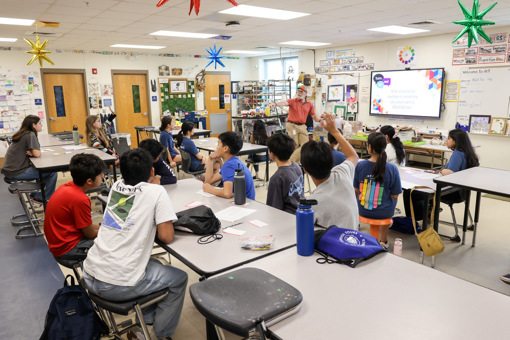 Middle school students at Visionary Voices Enrichment Event working on leadership projects and activities.