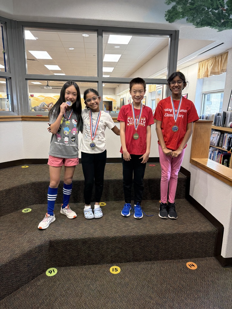 Students in a row with their medals 