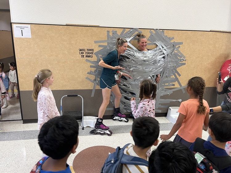 taping principal to the wall