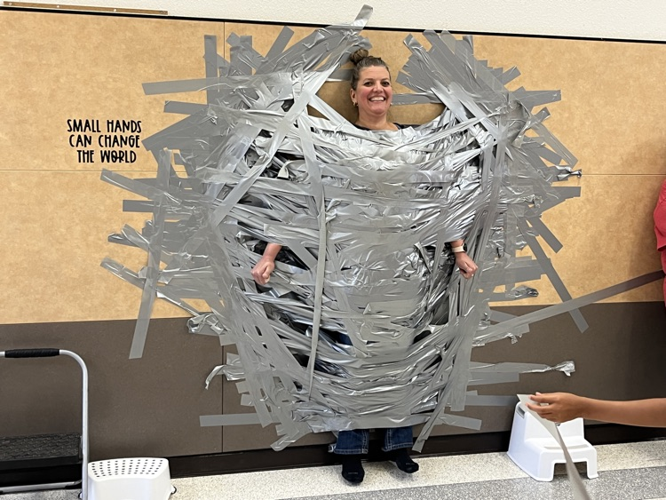 Ms. Elarms hanging on the wall. 