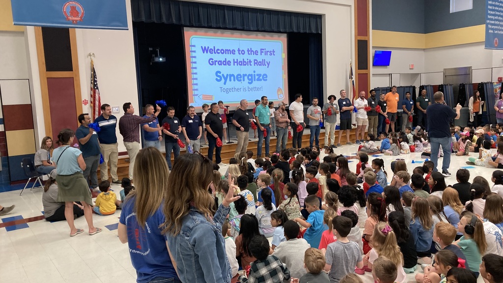 Group of dads in front of assembly