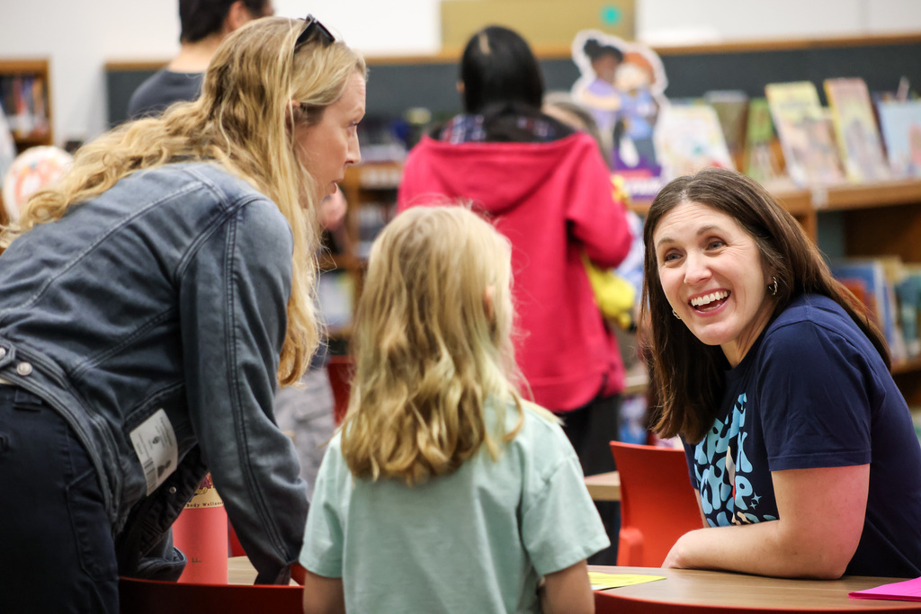 Community members and young kids attending our second early learning day while touring our schools.