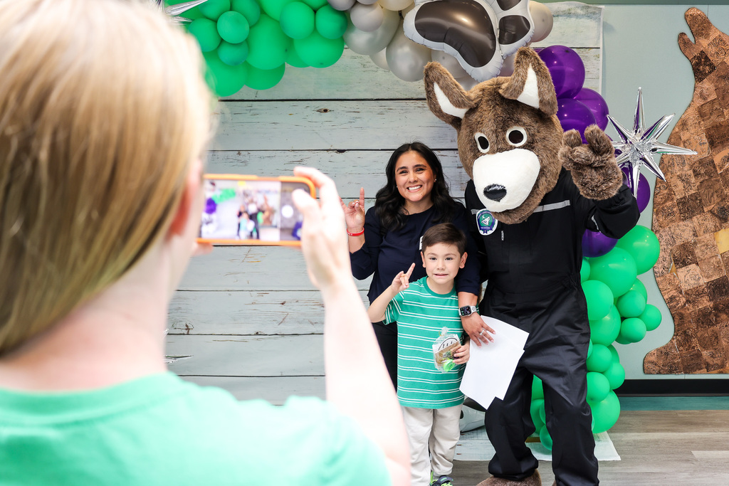 Community members and young kids attending our second early learning day while touring our schools.