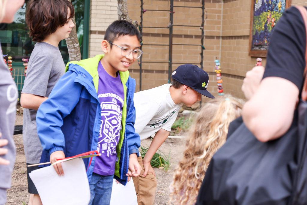 Community members and young kids attending our second early learning day while touring our schools.