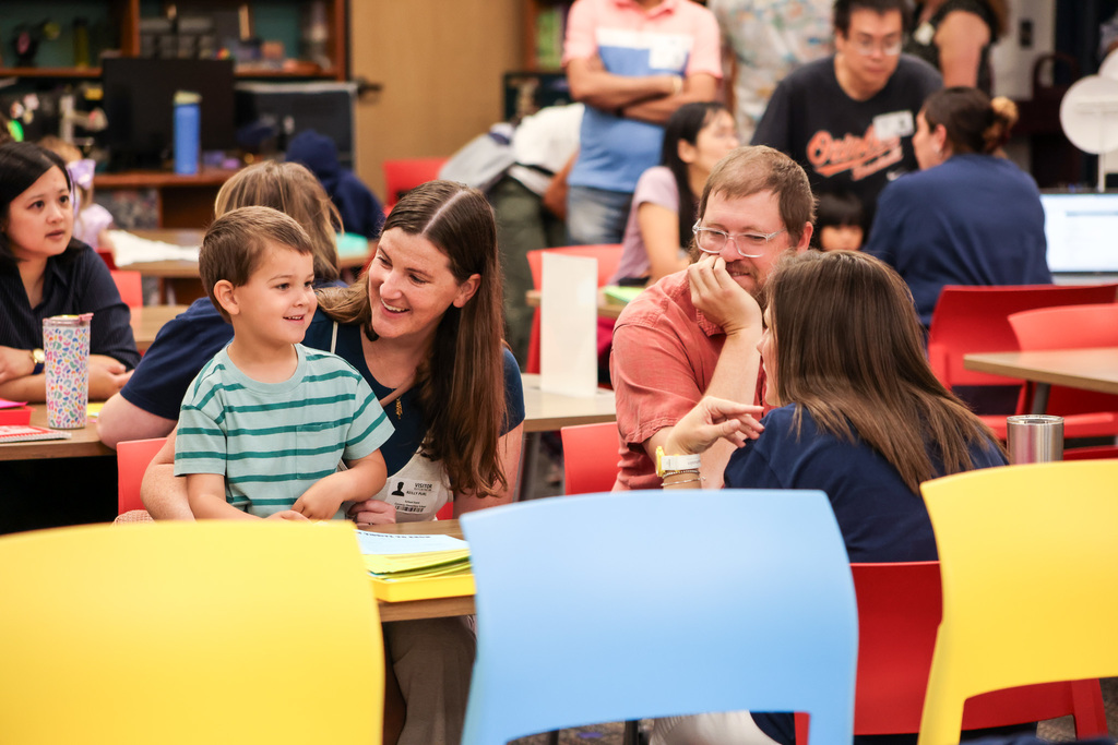Community members and young kids attending our second early learning day while touring our schools.
