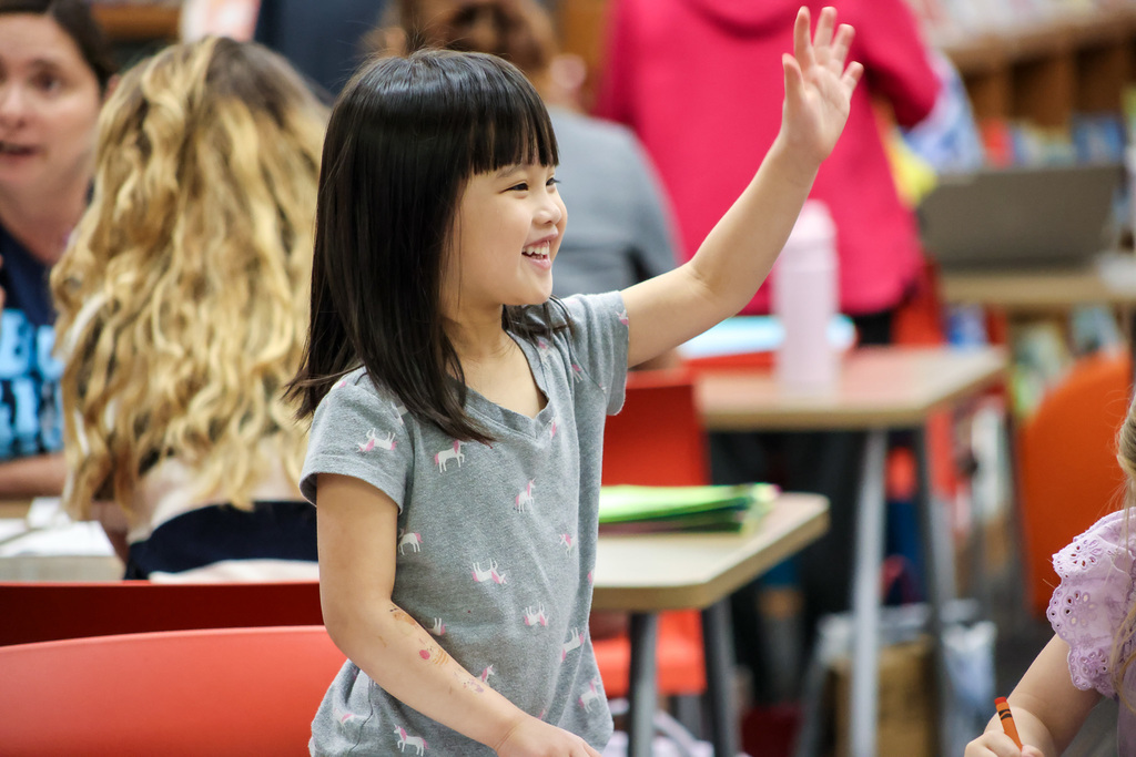 Community members and young kids attending our second early learning day while touring our schools.