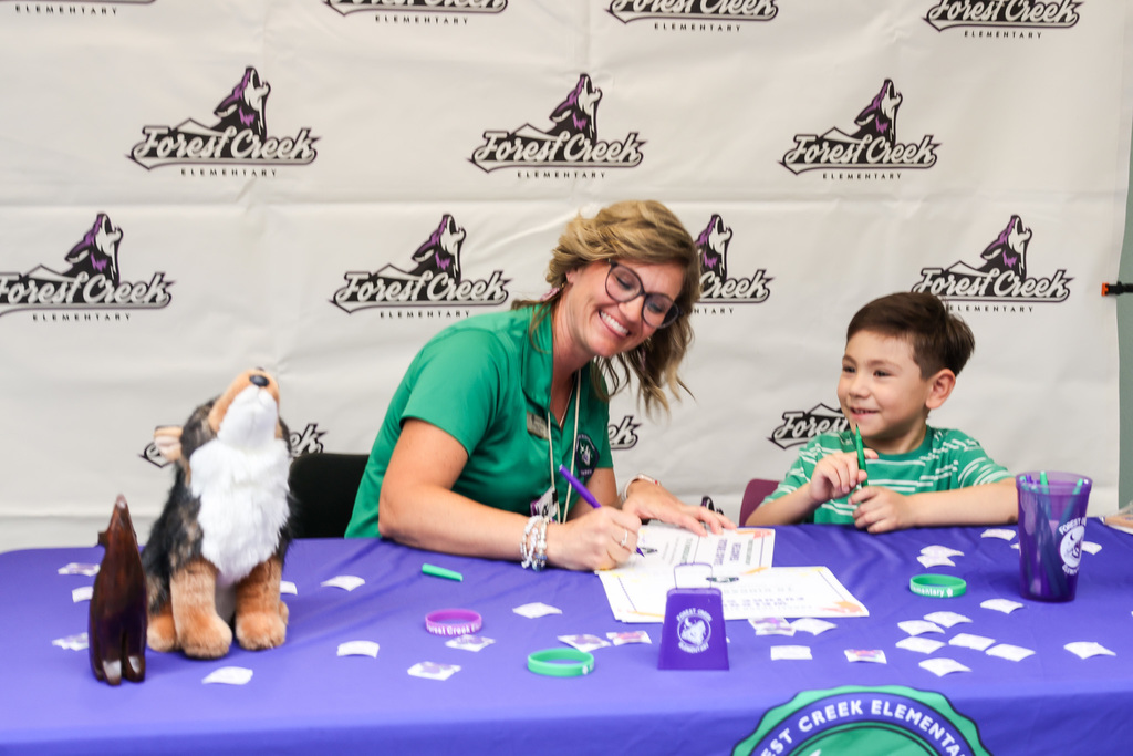Community members and young kids attending our second early learning day while touring our schools.