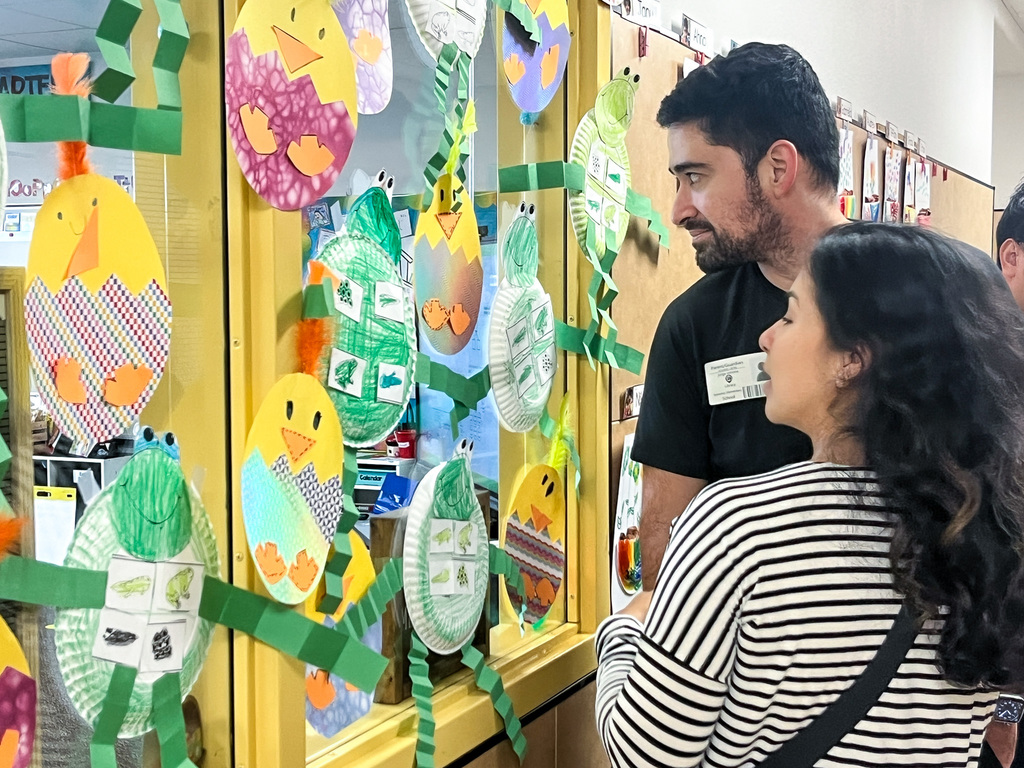 Community members and young kids attending our second early learning day while touring our schools.