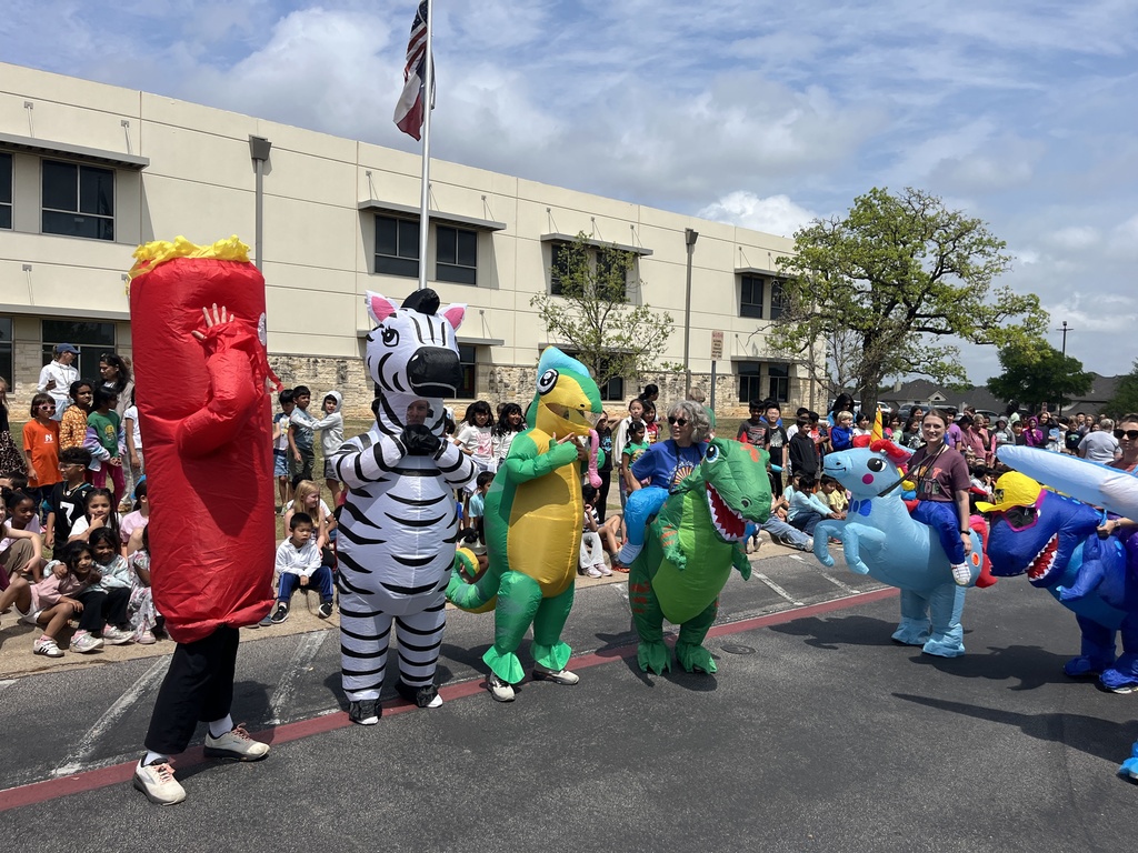 Teachers wearing inflatable costumes for the school fun run.  