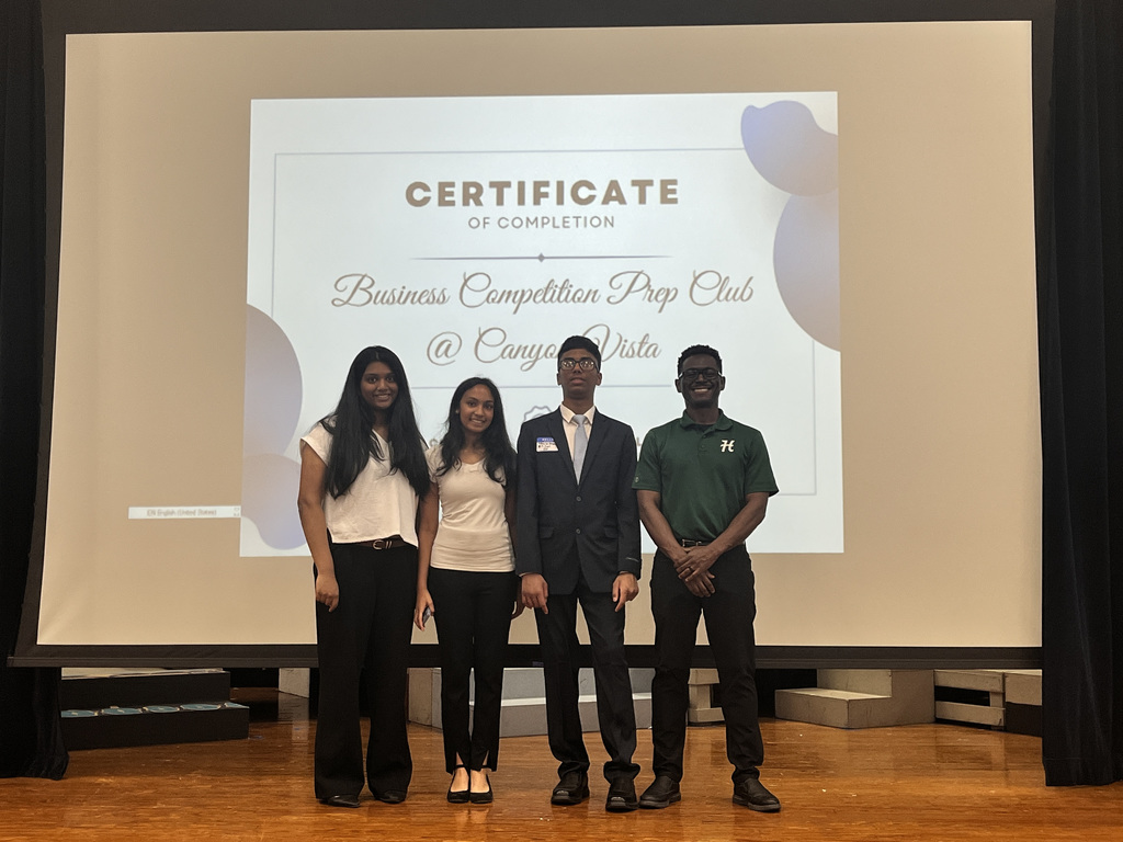 Picture of Hopewell's BIMM team in front of a certificate of completion Business Competition Prep Club  at Canyon Vista