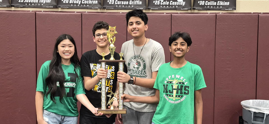 Picture of student winners holding trophy. 