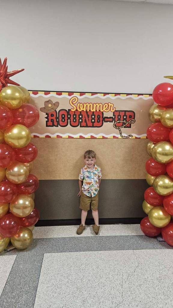 Future Sommer Stallion child standing at the balloon display.