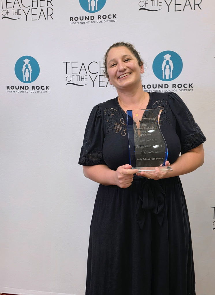 Picture of Dr. Eggers receiving teacher of the year for RRISD