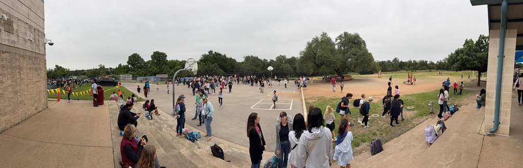 Panorama view of the Blackland Prairie Elementary playground filled with students and adults during the Donuts with Grown Ups event.
