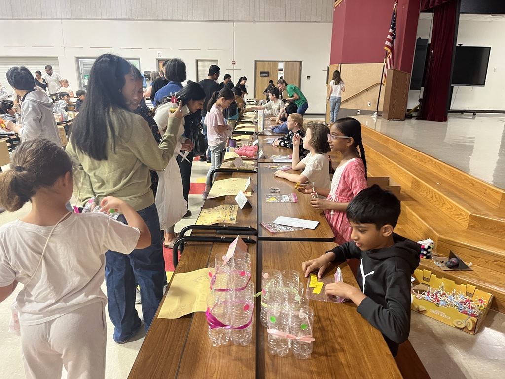 A table of products, sellers, and buyers at the fair. 