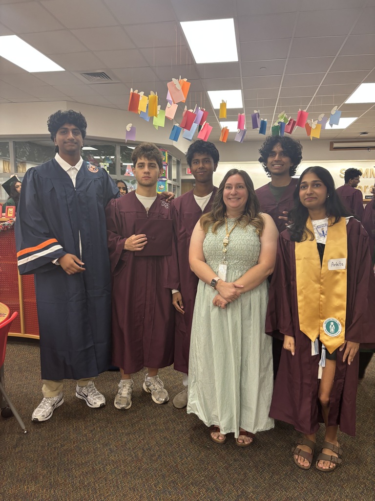 Mrs. Walton posing with former students.