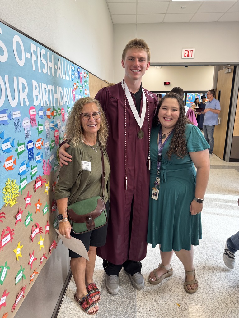 Mrs. Gagliardi posing with a mom and a former student. 