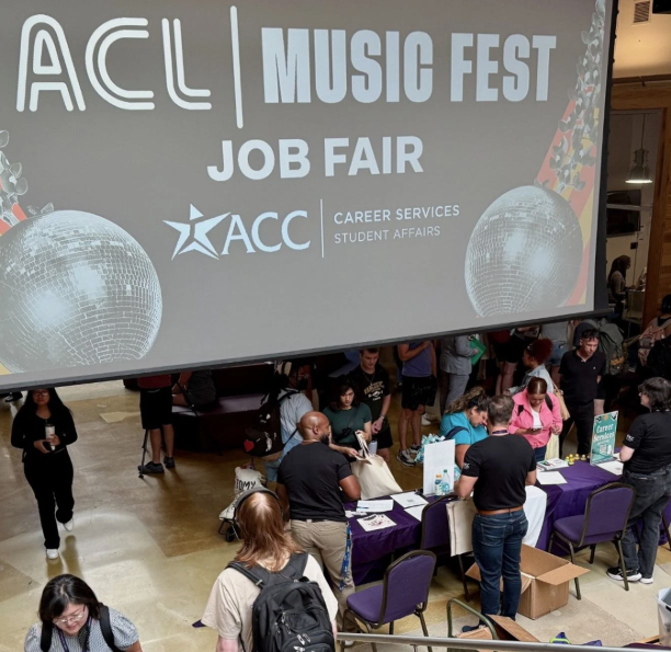 High-angle photograph of a bustling job fair inside an Austin Community College campus atrium. A large projection screen displays "ACL Music Fest Job Fair" alongside the ACC Career Services Student Affairs logo and disco ball graphics. Below, students and attendees interact with staff and recruiters at purple-cloth informational tables.