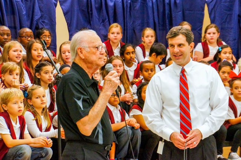 Heath Frazier with a veteran at an event at an elementary school