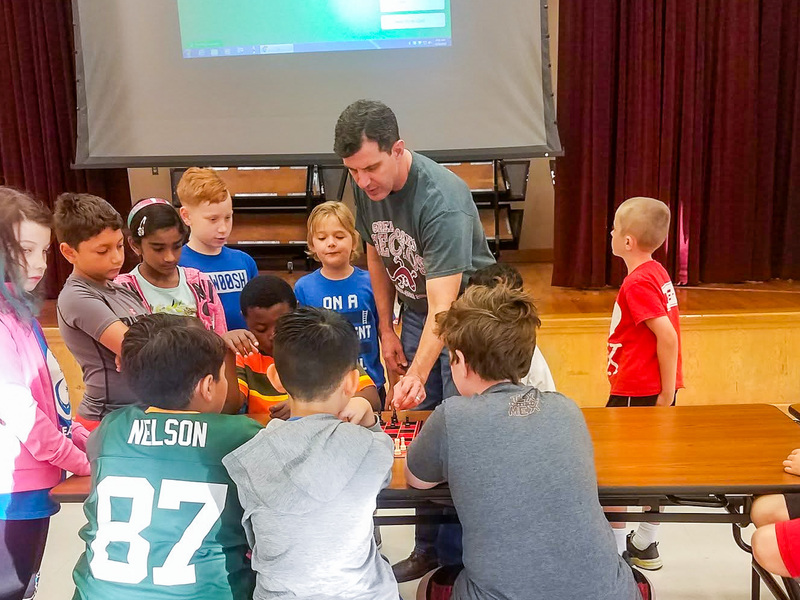 Heath Frazier with students