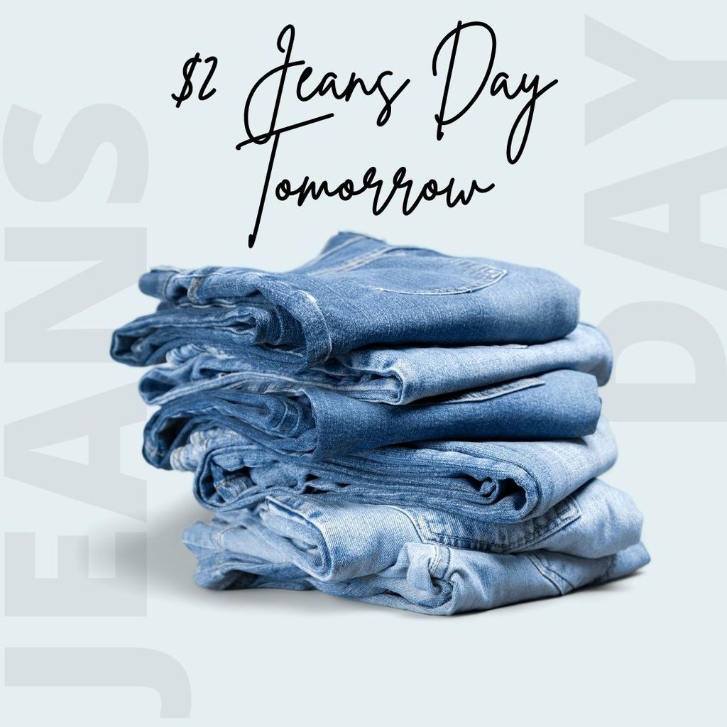 "$2 Jeans Day Tomorrow" above a pile of folded jeans