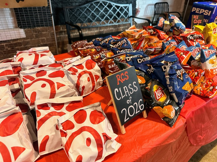 Chick-fil-A sandwiches on a table with a class of 2026 sign on it