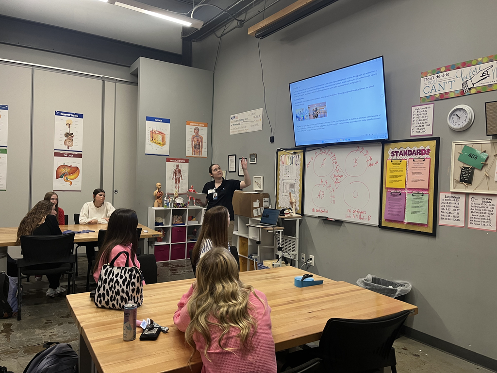 Whitney Williams presenting about physical therapy to students in a classroom