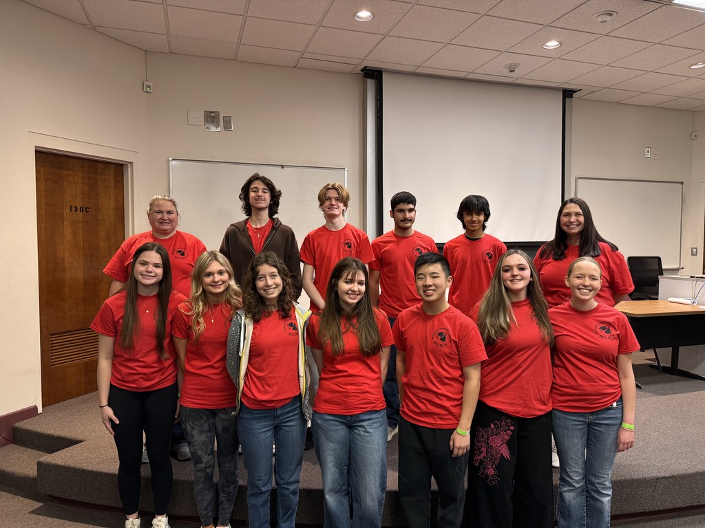 The RCS science olympiad team all in red t-shirts before the competition.