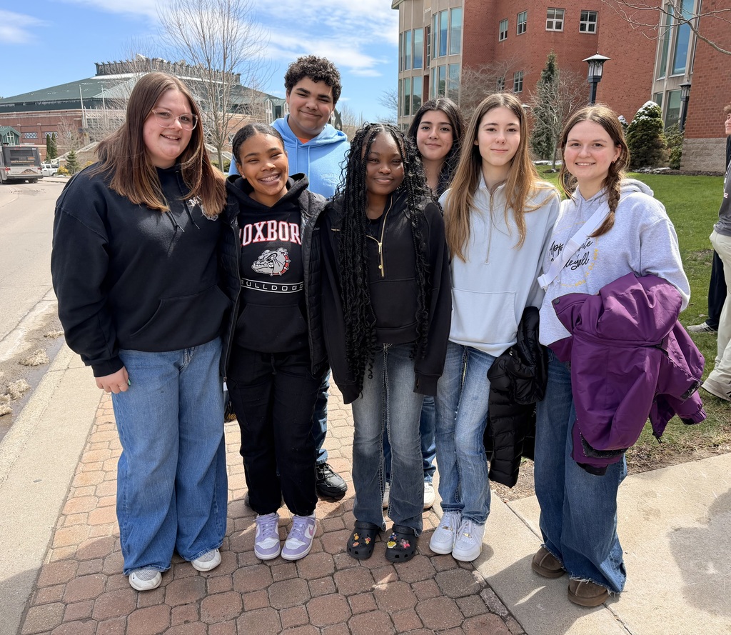 A group of high school students posing together and smiling
