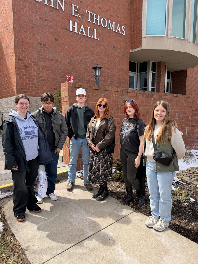 6 students standing outside of a brick building at App State